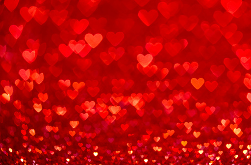 Red heart bokeh background. Valentines day texture.