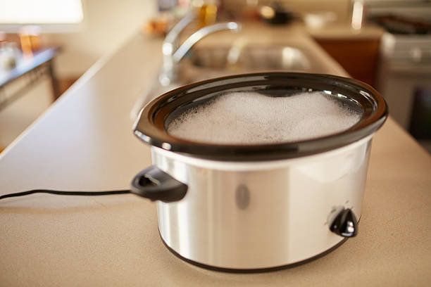 istock soaking slow cooker in soapy water 507519050