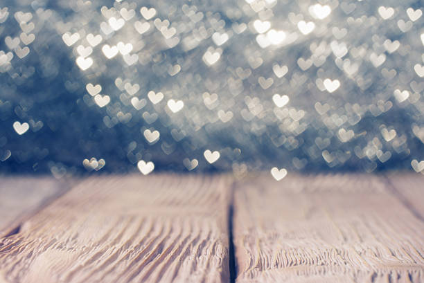 istock Vintage wooden  deck over heart shaped defocused lights. Shallow 507519618
