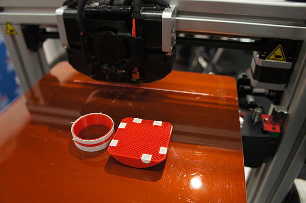 3D printed dice and circle on printbed Two multi-color 3D prints on 3D printer printbed - unfinished part showing fine infill structure polylactic acid stock pictures, royalty-free photos & images