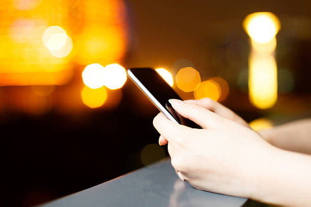 istock beautiful asian girl using mobile phone at night 507526136