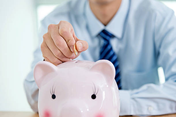 istock Young businessman saving money 507526172