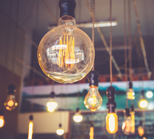 istock luxury edison light bulb in coffee shop 507526486