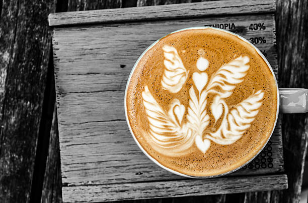 latte art coffee cup on wood background , selective color area process