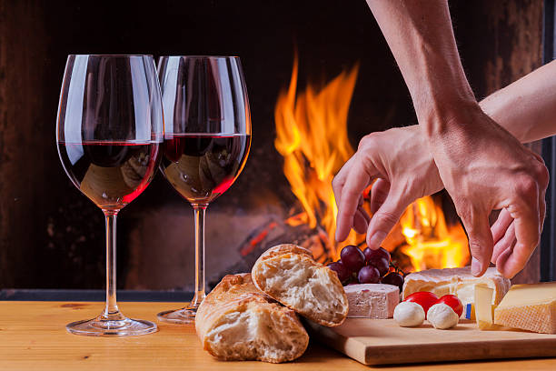 istock food snacks and red wine drinks at fireplace 507527426