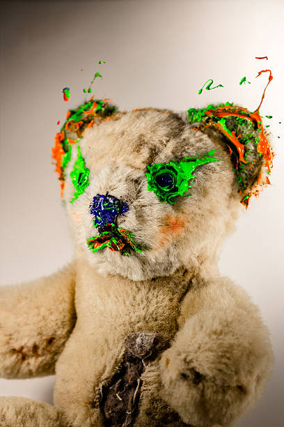 istock Magical teddy bear painted by green and orange 507530138