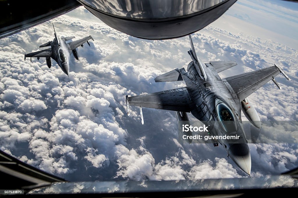 Mid-air Refueling Figher jets getting closer to KC-135 Stratotanker for mid-air refueling. Fighter Plane Stock Photo