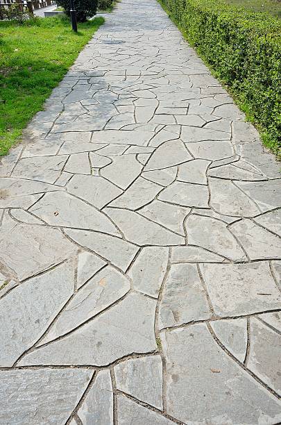 istock Stone brick footpath in the garden 507534340