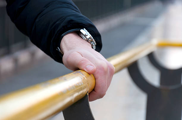 istock hand holding on to the handrail 507534478
