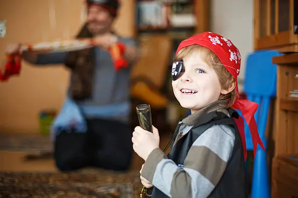 Photo of Little preschool boy of 4 years in pirate costume, indoors.