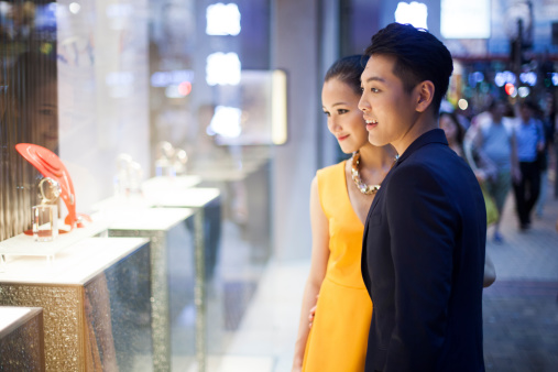 Young couple looking at jewelry in Hong-Kong