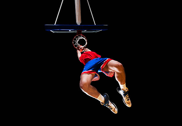 istock Basketball player slam dunking the ball. 507543637