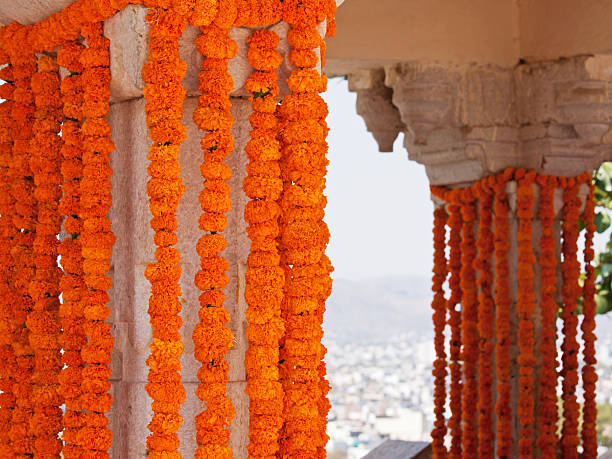 Marigold flower decorations hung from columns at a Hindu celebration in Rajasthan