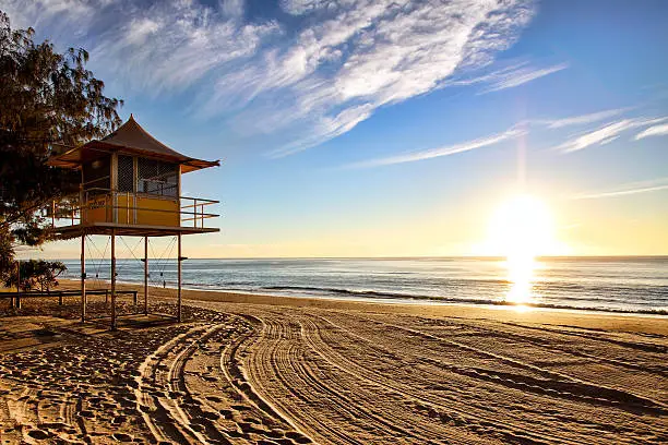 Lifeguard patrol tower on the beach at sunrise, Gold Coast, Australia