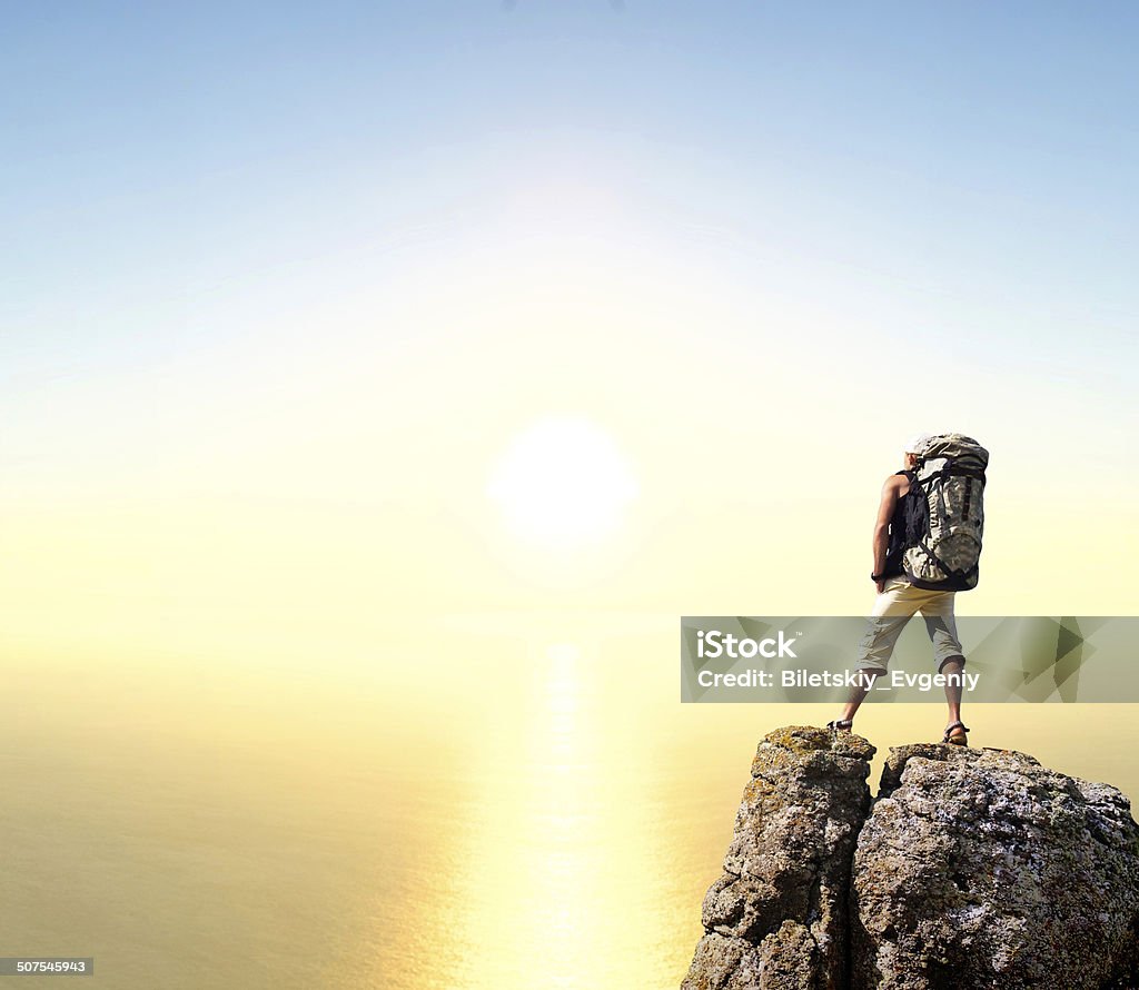 Active life concept Tourist on high rock. Sport and active life concept Activity Stock Photo