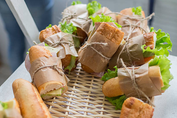 sandwiches in wicker basket stock photo