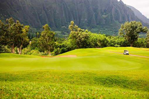 Golf course laid out at base of Ko'olau mountain range, Oahu, Hawaii