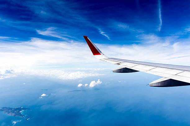 istock Sea of Clouds and airplane wing 507548990
