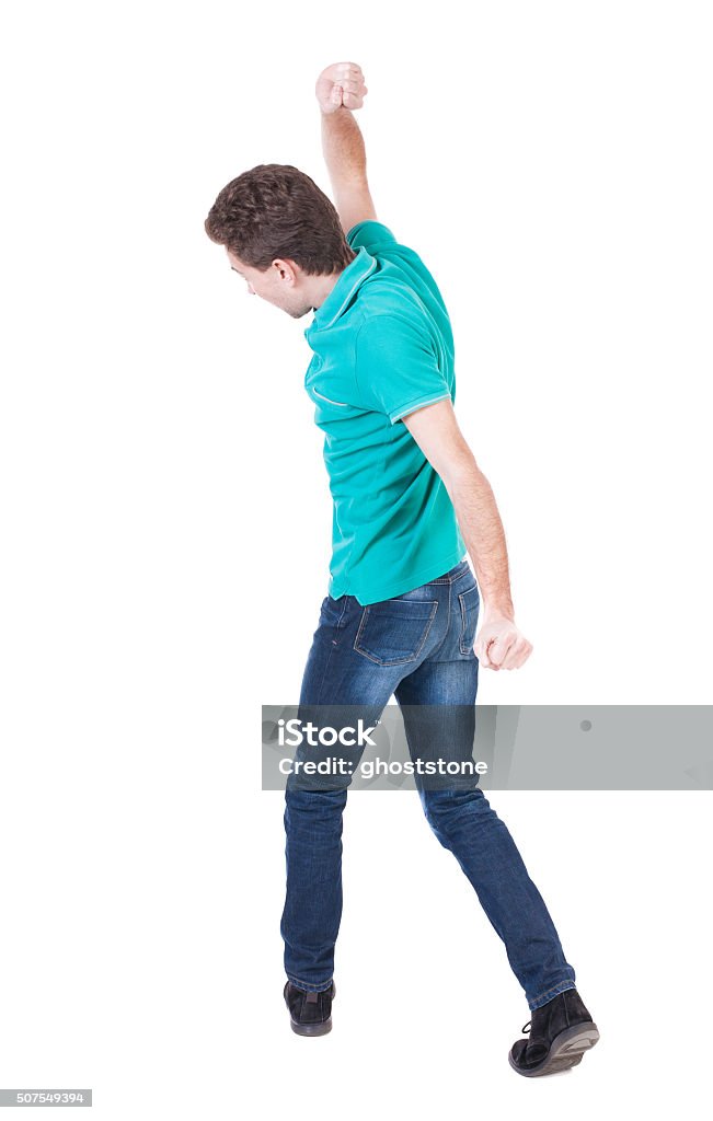 back view of skinny guy funny fights back view of skinny guy funny fights waving his arms and legs. Isolated over white background. Rear view people collection.  backside view of person. The guy in the blue sweater holds uppercut Aggression Stock Photo