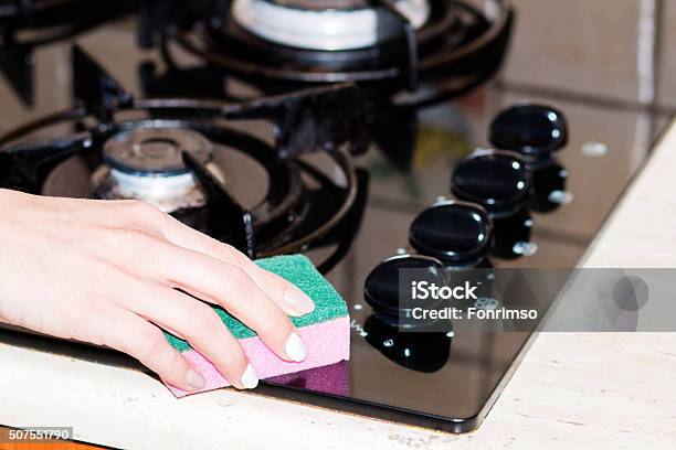 Woman Cleaning Stove In Kitchen Stock Photo - Download Image Now - Camping Stove, Cleaning, Hygiene