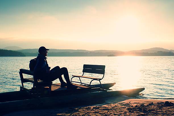 istock Man sit on abandoned old rusty pedal boat stuck 507552012