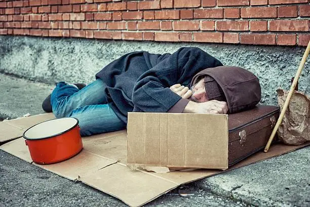 Photo of Homeless Sleeping on Sidewalk