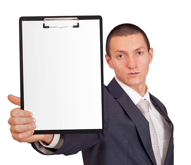 istock man holding a sheet of paper 507552710