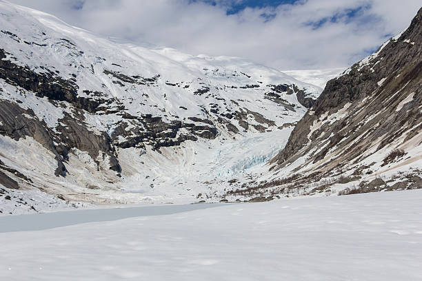 Nigardsbreen glacier and frozen lake stock photo