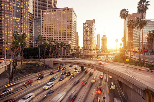 istock traffic through urban with sunset in los angle 507565798