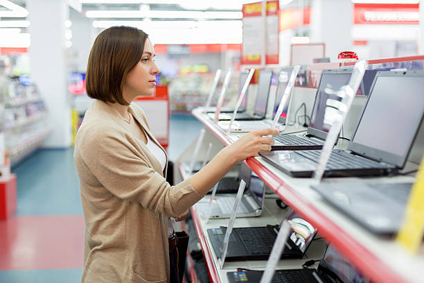 istock woman chooses the laptop 507565998