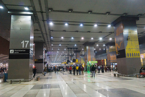 Indira Gandhi International Airport In Delhi India, middle of the night, on the grounds of Indira Gandhi International Airport Delhi India, some people can be seen walking in the background. india airport stock pictures, royalty-free photos & images