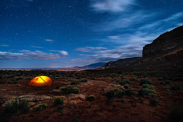 Backpacking and Camping Below the Kaiparowits Plateau Backpacking and Camping Below the Kaiparowits Plateau - Grand Staircase-Escalante, Utah USA. grand staircase escalante national monument stock pictures, royalty-free photos & images