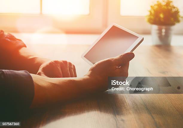 Person Looking To The Digital Tablet Stock Photo - Download Image Now - Digital Tablet, Computer, Desk