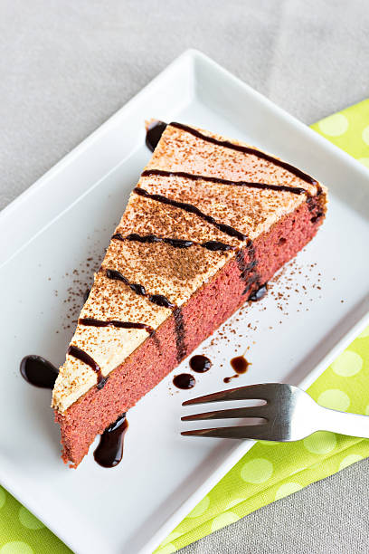istock Slice of beautiful red beetroot cake with cream topping 507568084