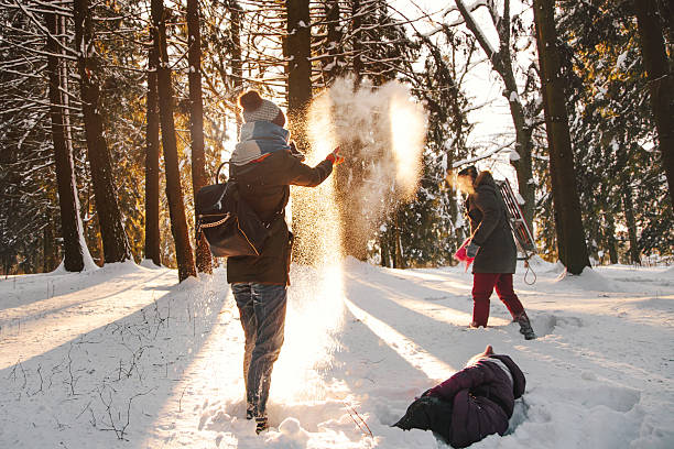 istock Cheerful family laughing in winter forest 507569306