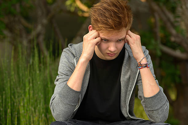 istock Sad teenager boy outdoors alone 507569434