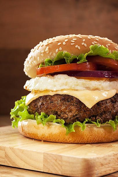 istock hamburger with pork grilled,egg fried and vegetable 507571540