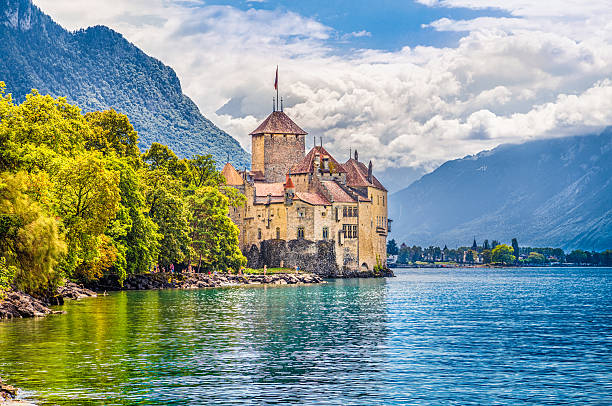 Chateau de Chillon at Lake Geneva, Canton of Vaud, Switzerland Montreaux, Switzerland - August 10, 2015: Beautiful view of famous Chateau de Chillon at Lake Geneva, one of Switzerland's major tourist attractions and one of the most visited castles in Europe, Canton of Vaud, Switzerland. chateau de chillon stock pictures, royalty-free photos & images