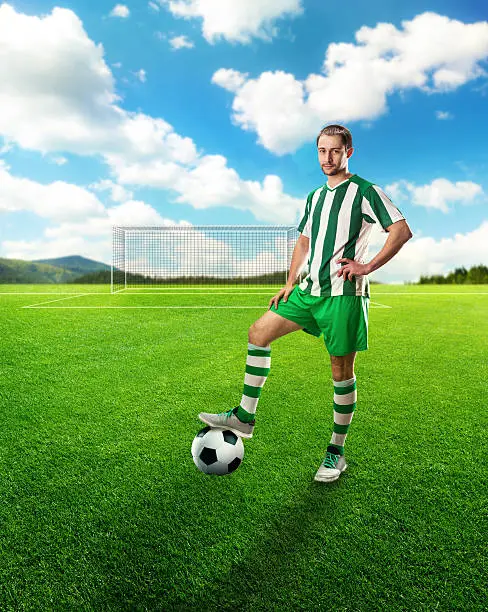 Football-player with the ball on the football ground