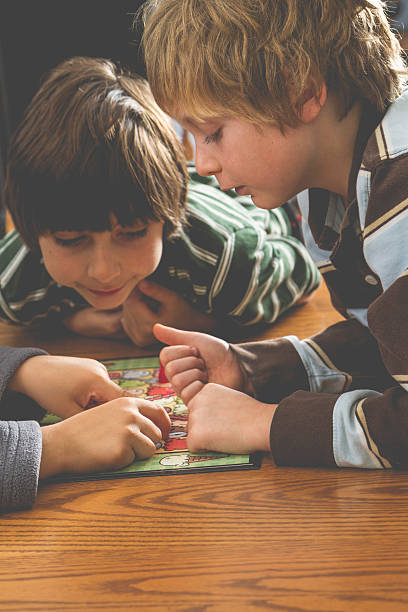 istock Family Playing A Board Game Together 507573774