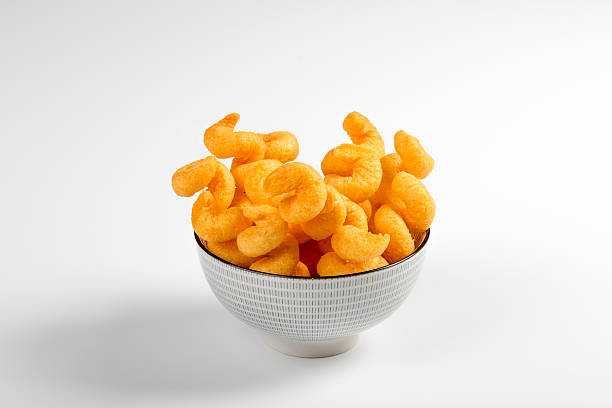 istock bowl of crisps corn on a white background 507575584