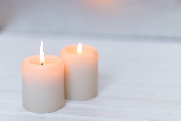 istock Candles on a white wood background 507575814