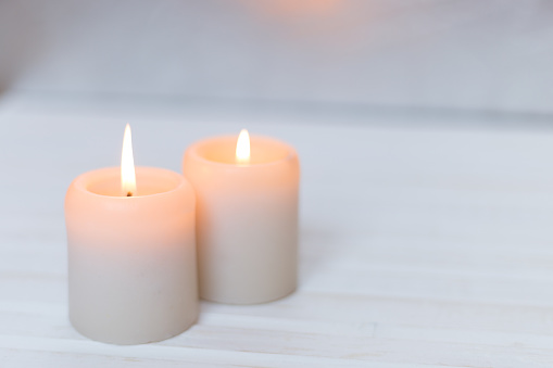 Candles on a white wood background