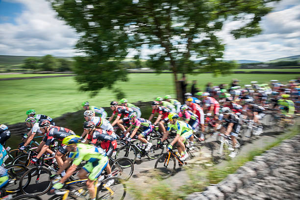 Rainbow Jersey Threshfield, Yorkshire Dales, UK – July 05, 2014: Rui Alberto Faria da Costa amongst the peloton of Stage 1 of the 2014 edition of Le Tour De France. tour de france stock pictures, royalty-free photos & images