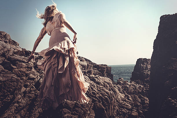 istock Beautiful woman by the ocean 507577485