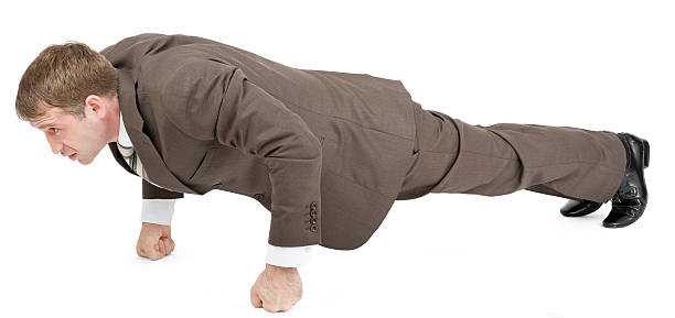 istock Businessman doing push-ups on fists 507578368