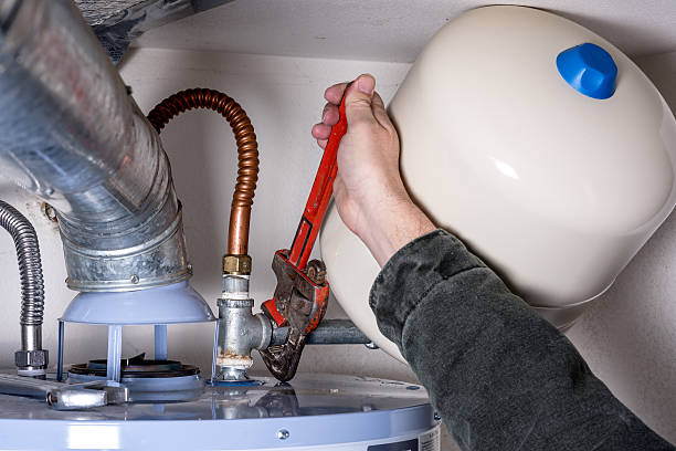istock Tightening a pipe on a water heater 507578902
