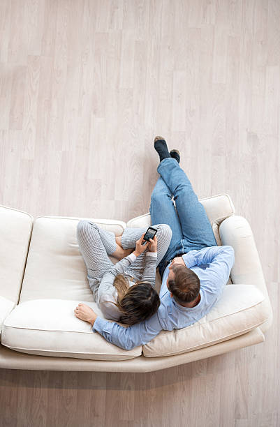 istock Couple relaxing at home on the sofa 507579202