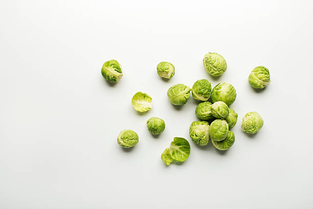 Brussels sprout Fresh raw Brussels sprouts isolated on a white background. brussels sprout stock pictures, royalty-free photos & images