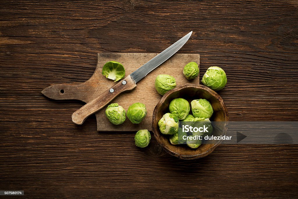 Brussels sprout Fresh raw Brussels sprouts on a wooden background. Brussels Sprout Stock Photo